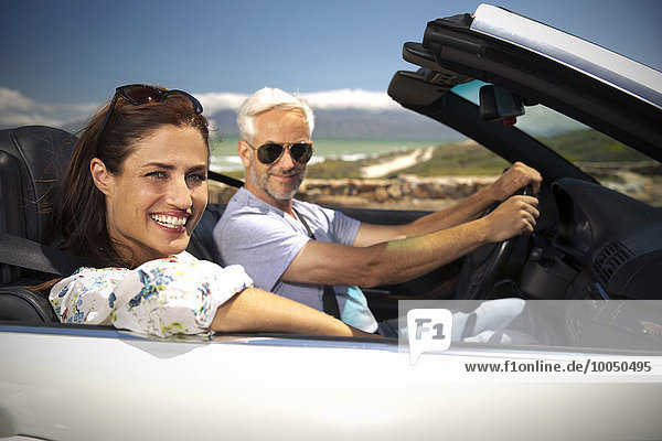 South Africa  portrait of smiling couple sitting in a convertible