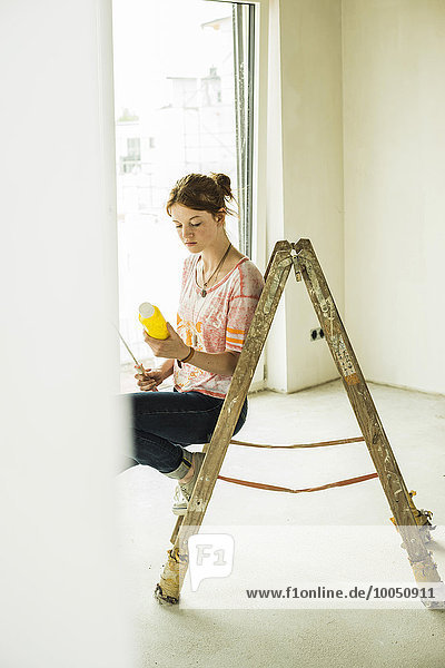 Young woman renovating