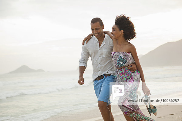 Romantic couple strolling on beach  Rio De Janeiro  Brazil