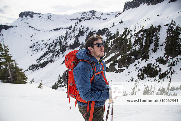 Young male skier looking out from mountainside  Mount Baker  Washington  USA