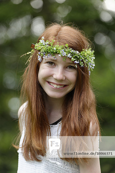 Flower child  girl with flower wreath in her hair
