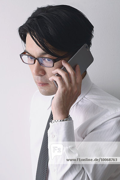 Japanese businessman working with large display smartphone