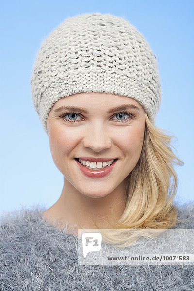 Portrait of a beautiful woman in knitted hat