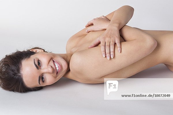 Naked woman smiling