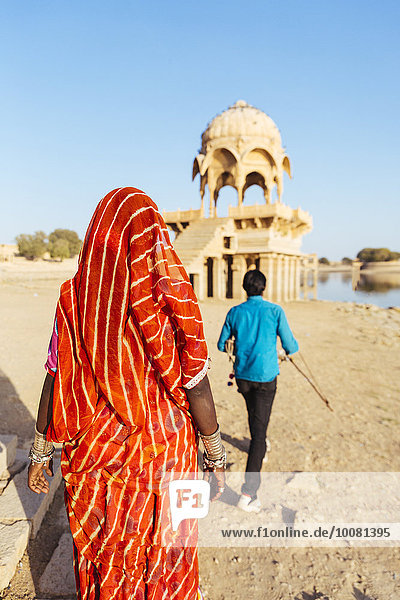 Indian couple visiting tower monument  Jaisalmer  Rajasthan  India