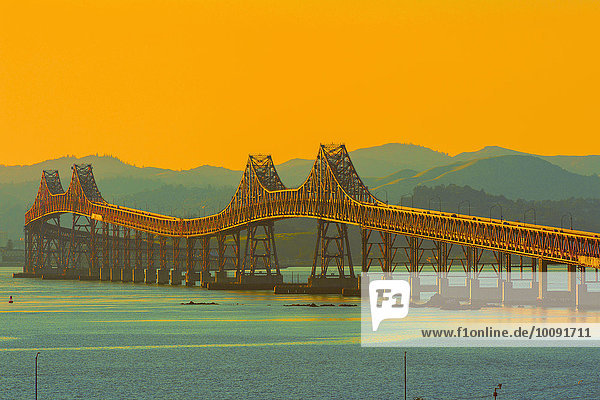 Bridge and river under sunset sky  Richmond  California  United States