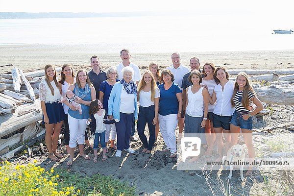 Portrait of four generation family on beach