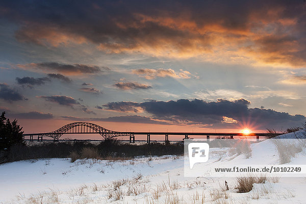 Winter sunset over the Robert Moses Causeway in New York.