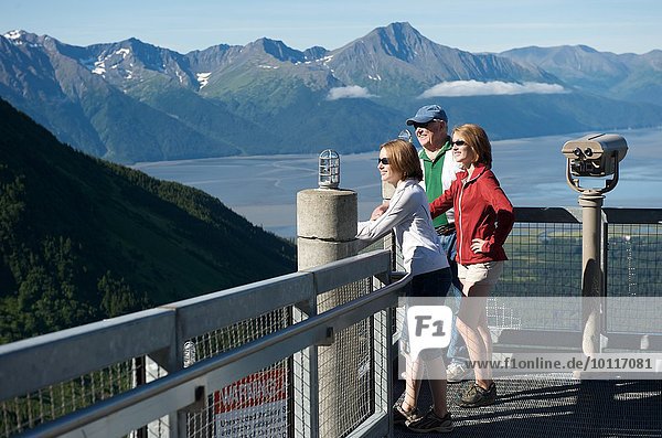 Tourists looking at view from Roundhouse observation deck  Alyeska Resort  Girdwood  Alaska  USA