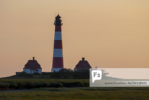 Westerhever lighthouse against the evening sky  Westerheversand  Schleswig-Holstein  Germany  Europe