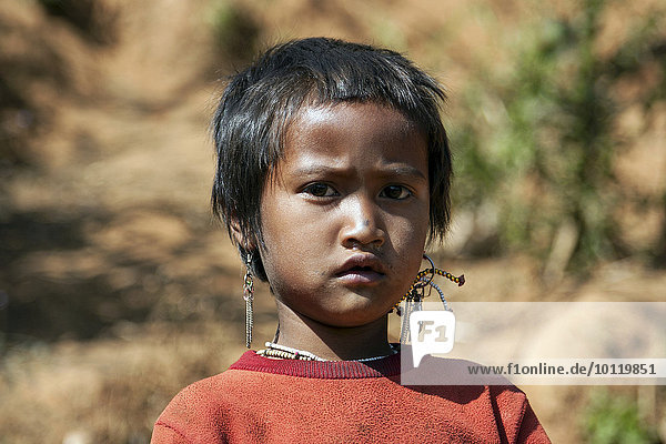 Local girl from the Ann tribe in a mountain village at Pin Tauk  portrait  Shan State Golden Triangle  Myanmar  Asia