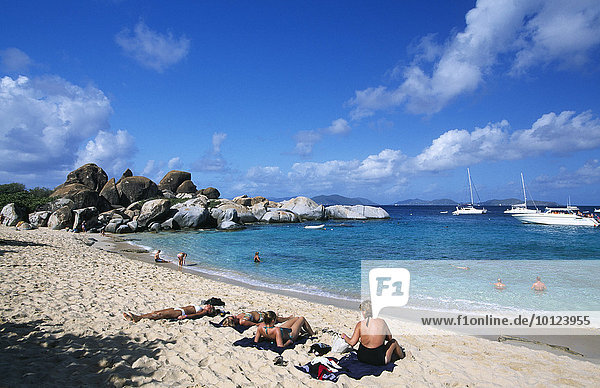 Vacationers in front of The Baths  a rock formation on Virgin Gorda Island  British Virgin Islands  Caribbean  North America