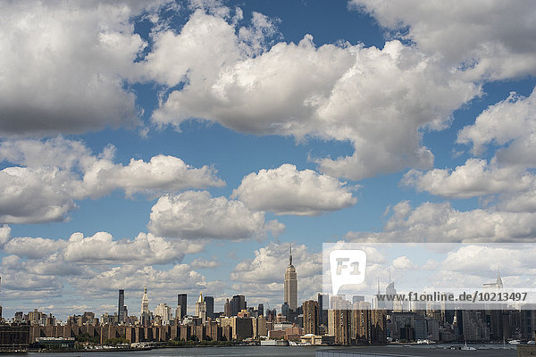 New York City skyline under cloudy blue sky  New York  United States