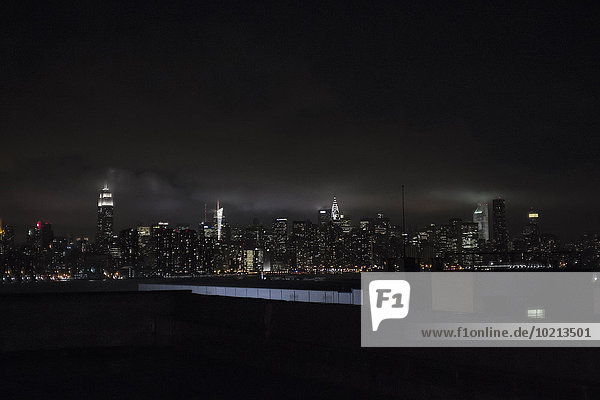 Illuminated New York City skyline at night  New York  United States