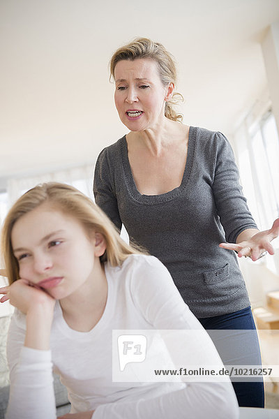 Caucasian mother arguing with daughter