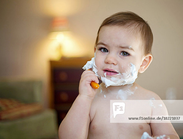 Portrait of little boy shaving