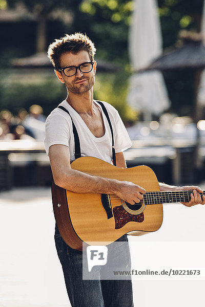 Portrait of young man with guitar