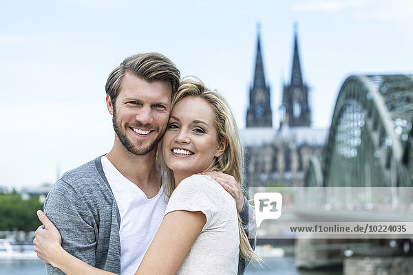 Germany  Cologne  portrait of smiling young couple head to head