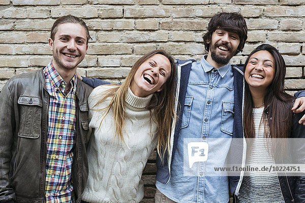Group picture of four friends having fun together