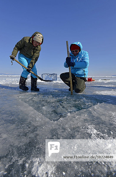 Russia  Lake Baikal  preparation of an ice hole for ice diving