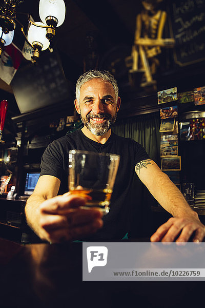 Portrait of man working in an Irish pub