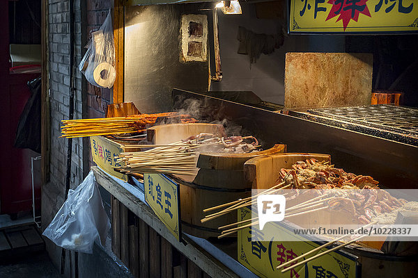 China  Shanghai  barbecued seafood on a street food stand