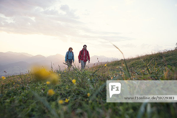 Austria  Tyrol  couple hiking at Unterberghorn at sunrise
