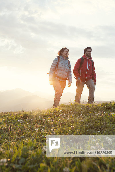 Austria  Tyrol  couple hiking at Unterberghorn at sunrise