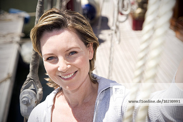 Portrait of a smiling mature woman on a sailing ship