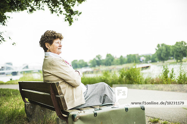 Senior woman sitting on bench