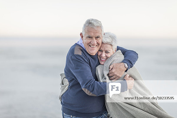 South Africa  Cape Town  portrait of senior couple on the beach
