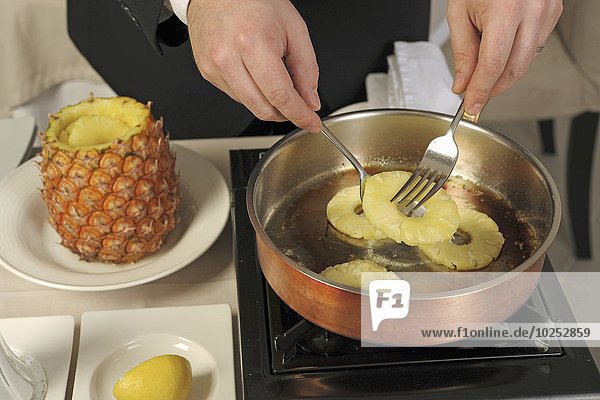 Preparing a pineapple flambé