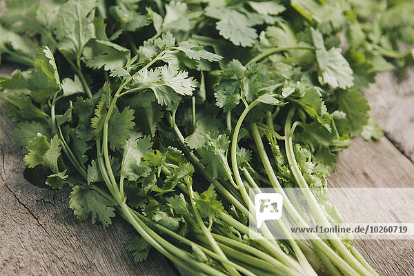 Close-up of coriander leaves on table