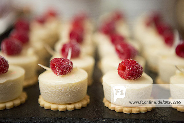 Close-up of Rows of Cookies topped with Raspberries