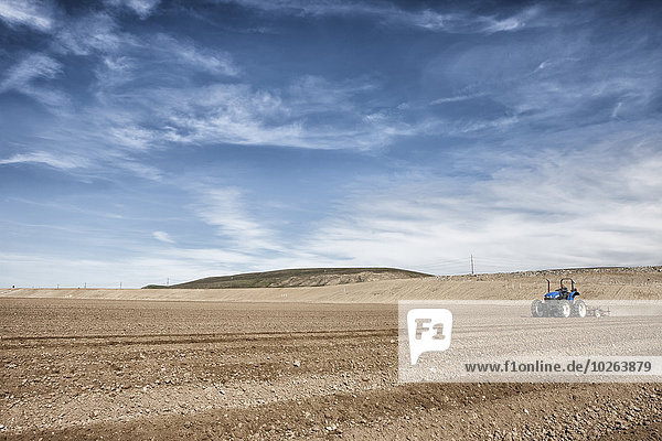 Ploughing field to ready for crops; Salinas  California  United States of America