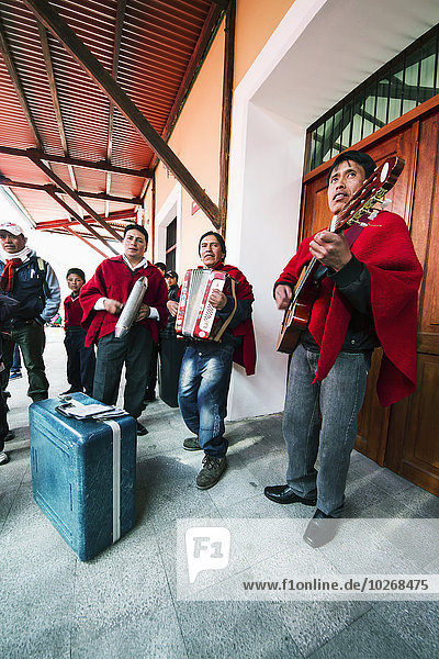 Musical ensemble playing at the railway station  Guamote  Chimborazo  Ecuador