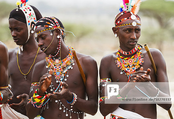 Samburu men singing and dancing  Samburu County; Kenya