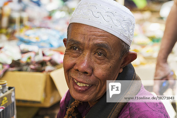 Man at the weekly market  Semparu  Lombok  West Nusa Tenggara  Indonesia
