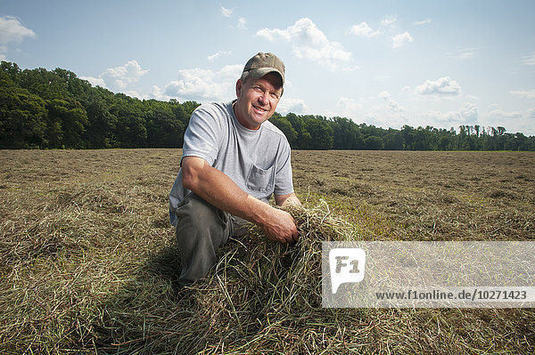 'Farmer in hay field; Sudlersville  Maryland  United States of America'