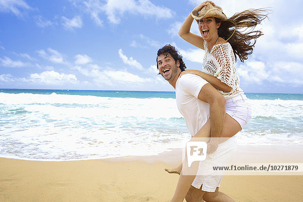 'Couple on the beach; Kealia  Kauai  Hawaii  United States of America'
