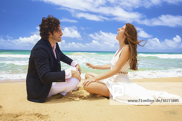 'Couple on a beach; Kealia  Kauai  Hawaii  United States of America'