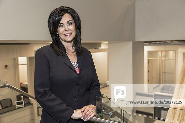 'Portrait of a professional businesswoman in office setting; Edmonton  Alberta  Canada'