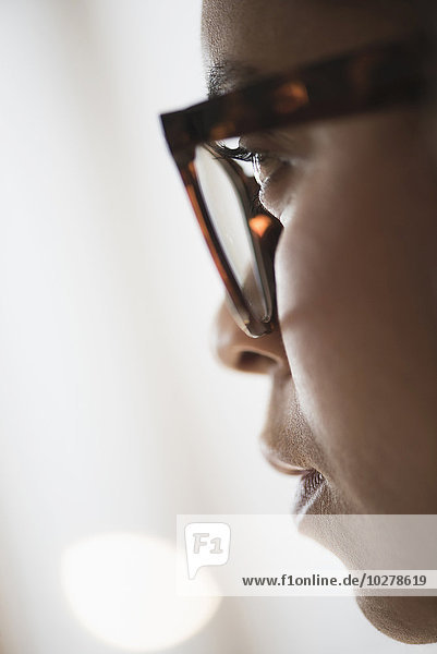 Close up of young woman in nerdy glasses