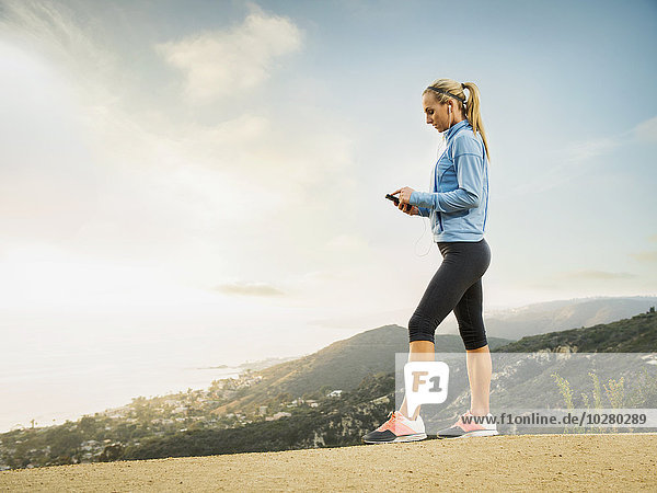 Woman checking smart phone