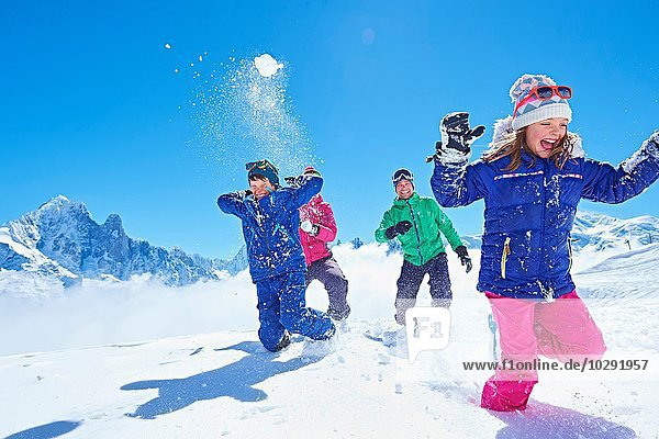 Family having snowball fight  Chamonix  France