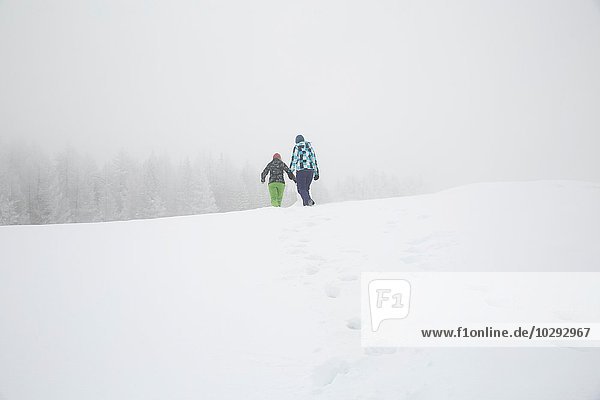 Women enjoying snow  Sattelbergalm  Tirol  Austria