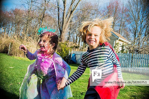 Children in costumes playing outdoors