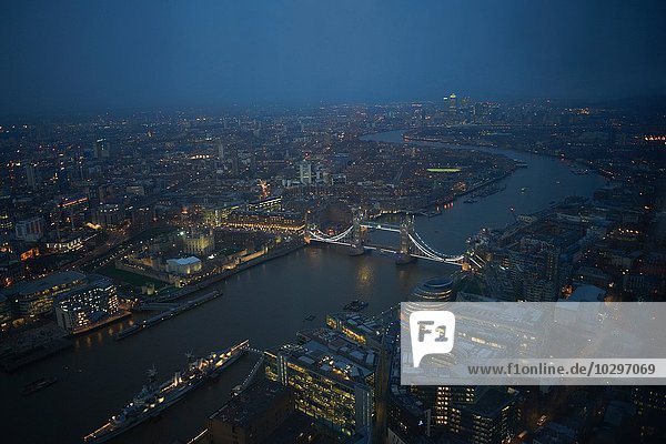 Aerial cityscape of river Thames and Tower bridge at night  London  England  UK