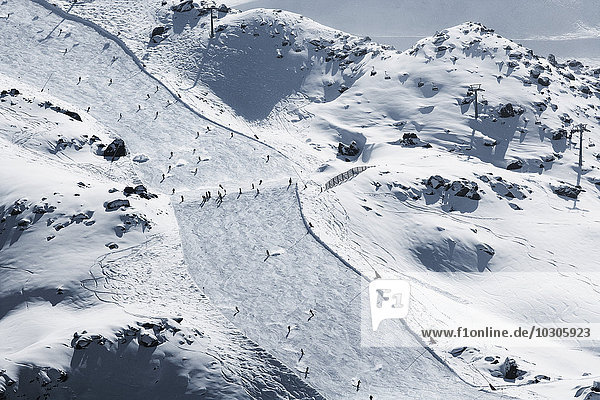Austria  Tyrol  Ischgl  skiers on slope in winter landscape