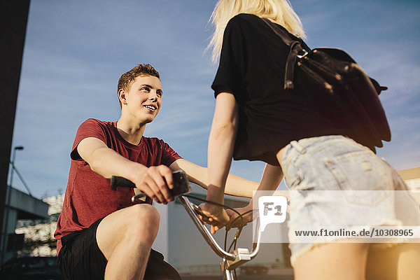 Young couple with BMX bicycle